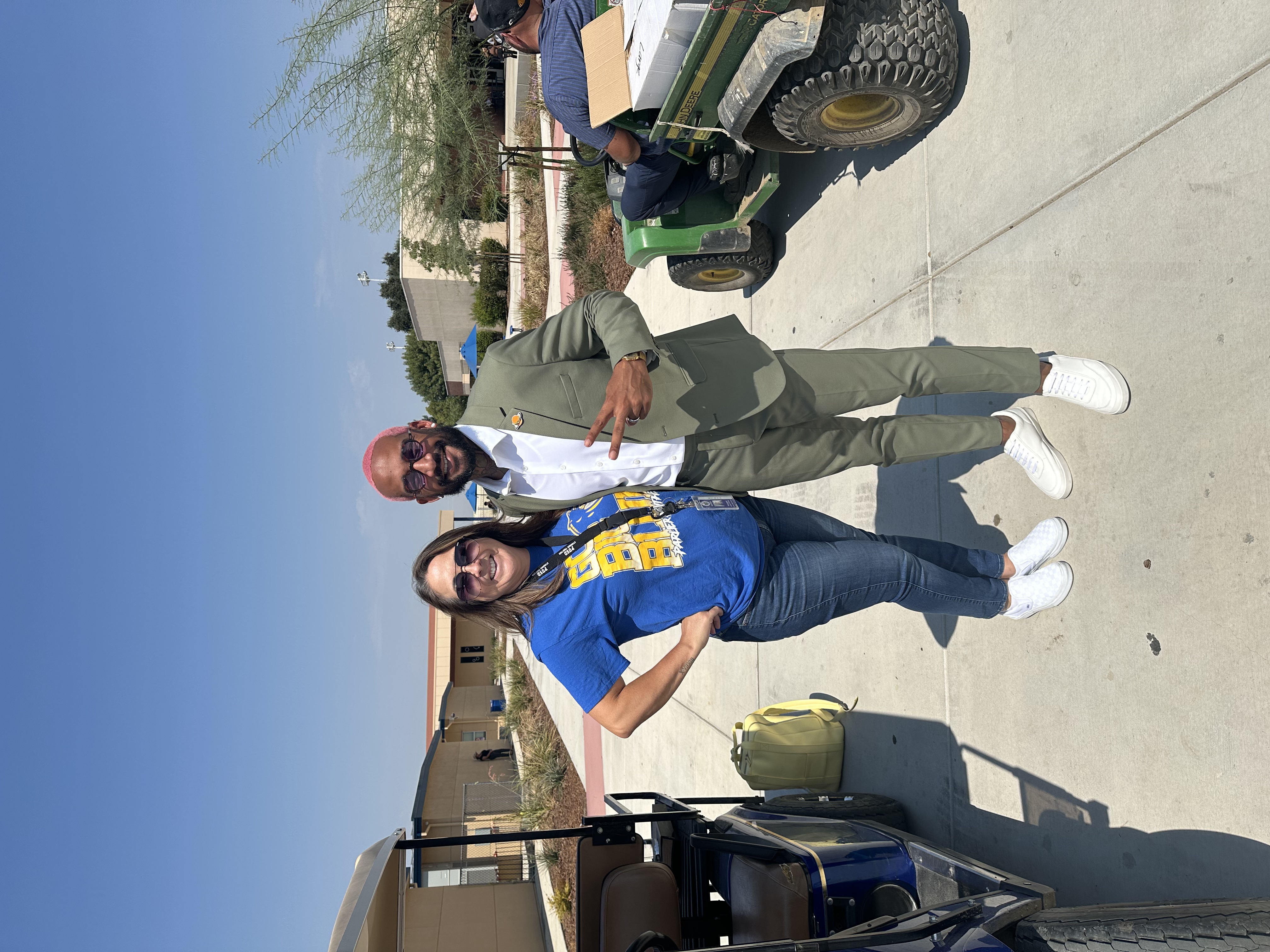 Chris with school staff outside