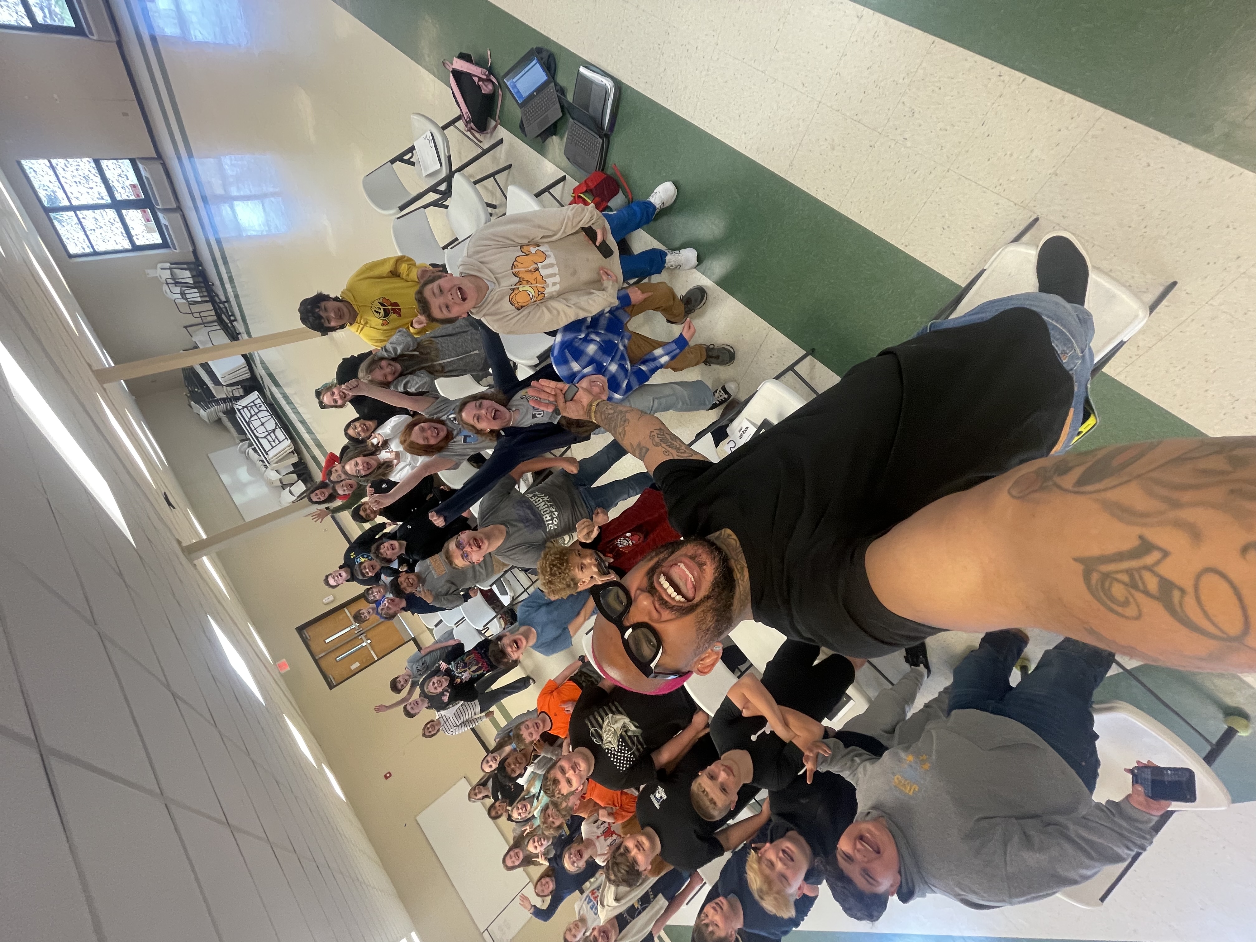 Chris with students bleachers